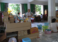 volunteered nuns and monks at Wat Pak Nam sorting and distributing contributing stuffs from devotteee