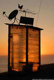 Guard tower near the beach during sunset