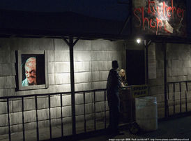 Night chat outside the entrance in a cold chilly windy night