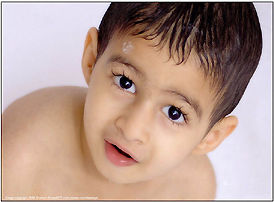 joyful face of a kid at bath room